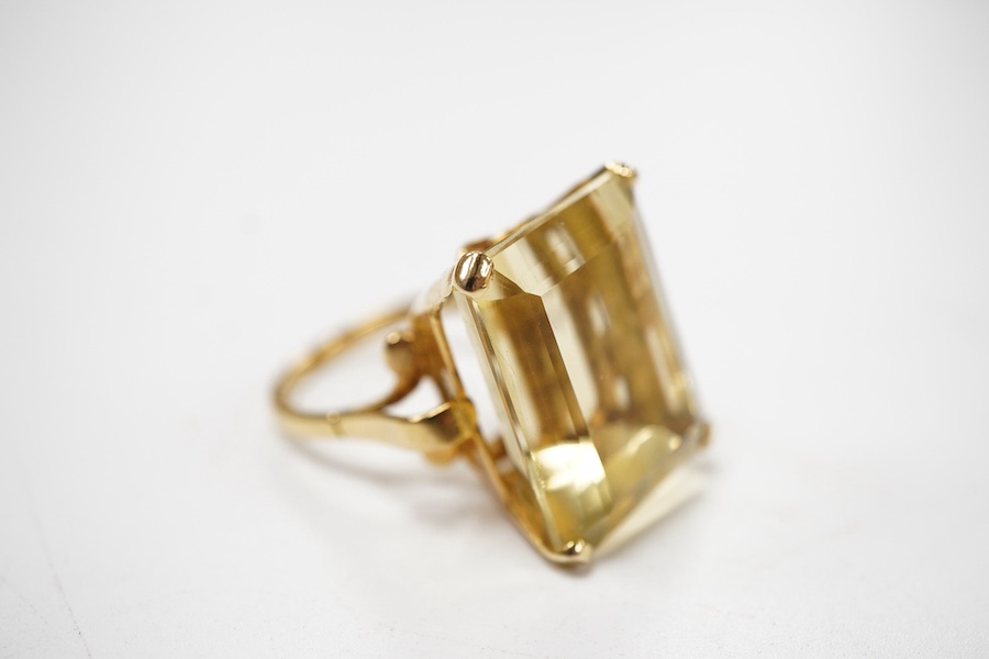 A citrine ring, circa 1973, claw-set with a step-cut citrine measuring approximately 19 x 15 x 11mm, mounted in 9ct gold, size M, British hallmarks, gross weight approximately 10 grams
